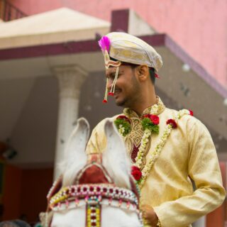 Groom on white horse
