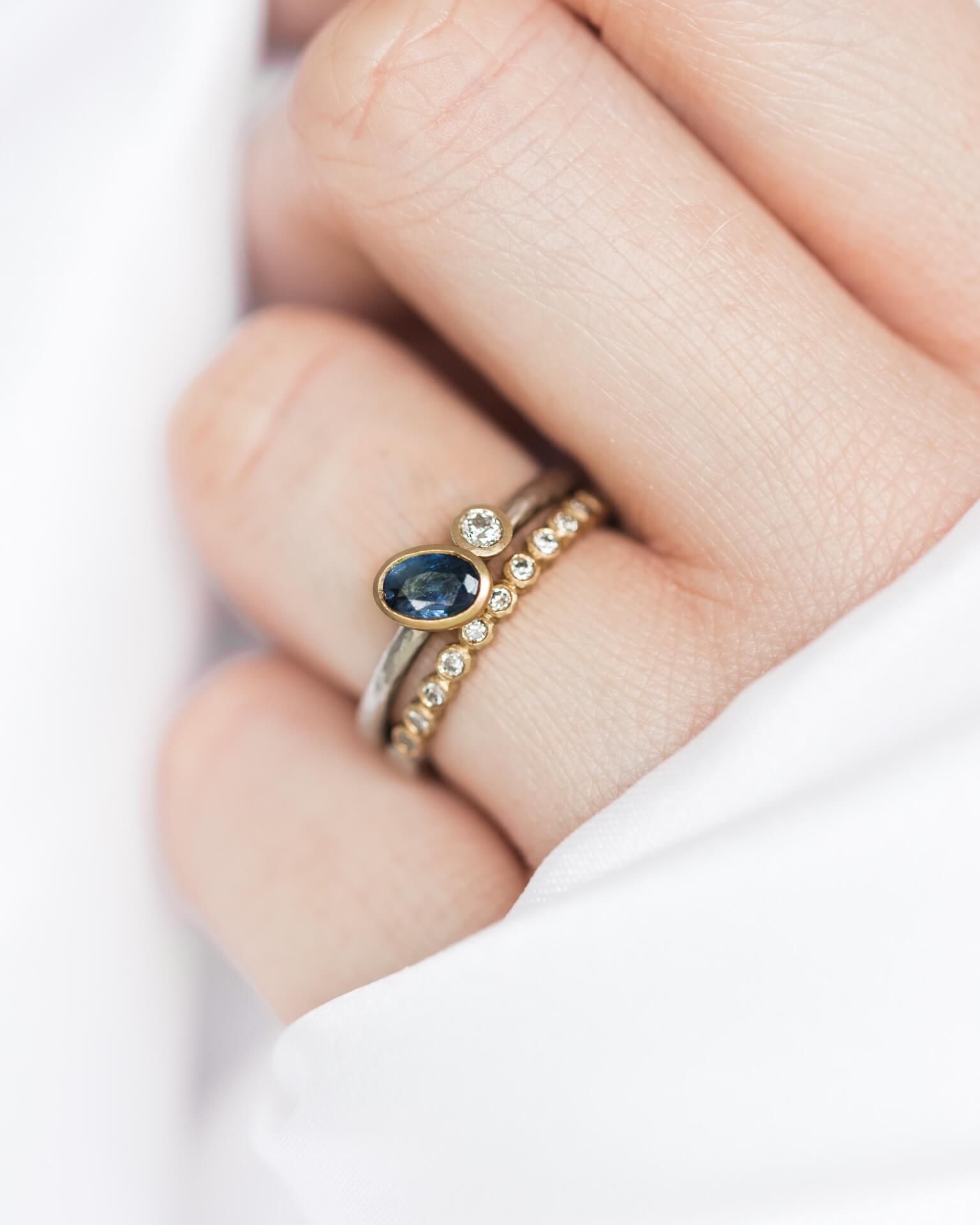 oval-sapphire-diamond-ring-with-thin-diamond-wedding-ring-jacks-turner-bristol