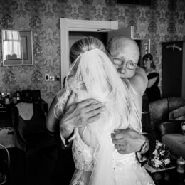 dad hugs bride at wedding in kent Dover 260x260