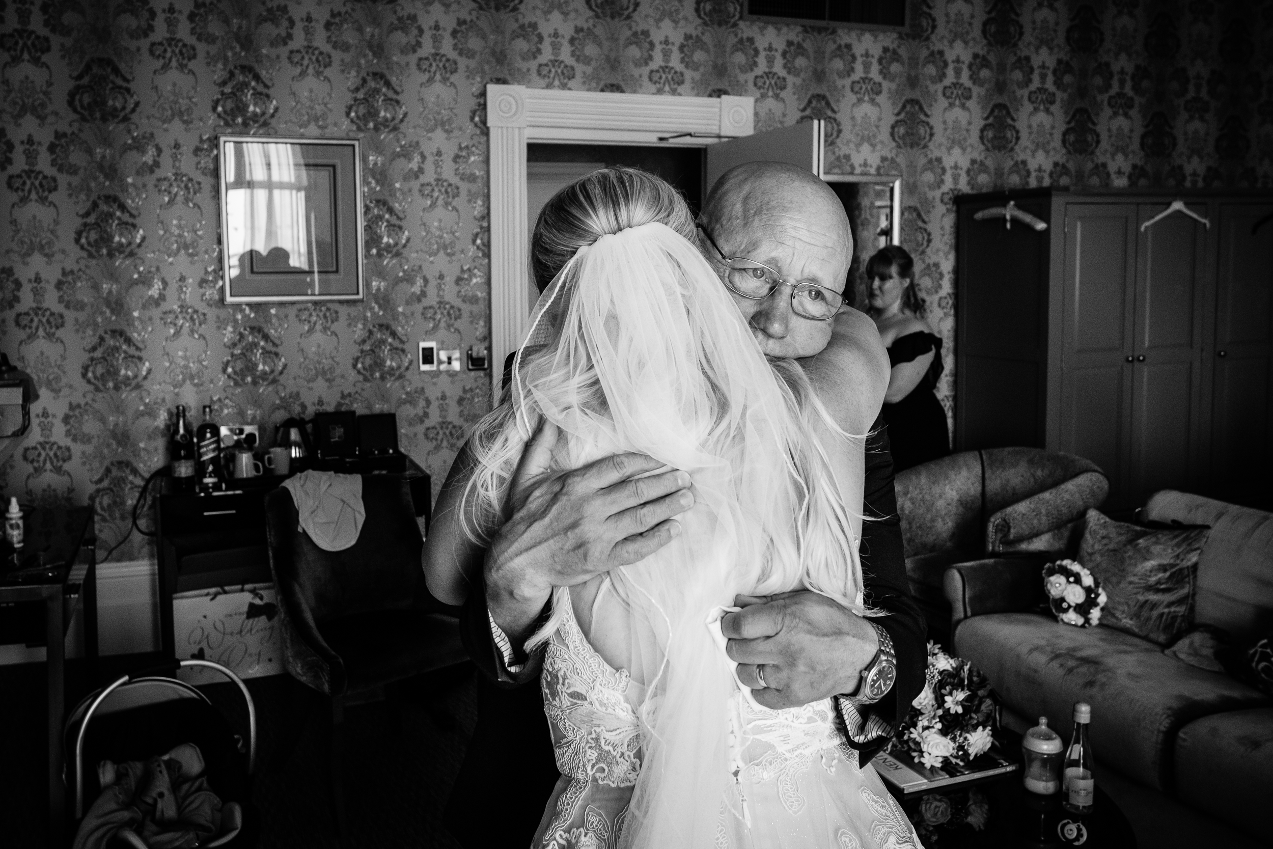 dad hugs bride at wedding in kent Dover