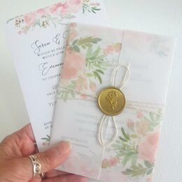 blush pink lforal wedding invitation with vellum wrap and gold wax seal 260x260