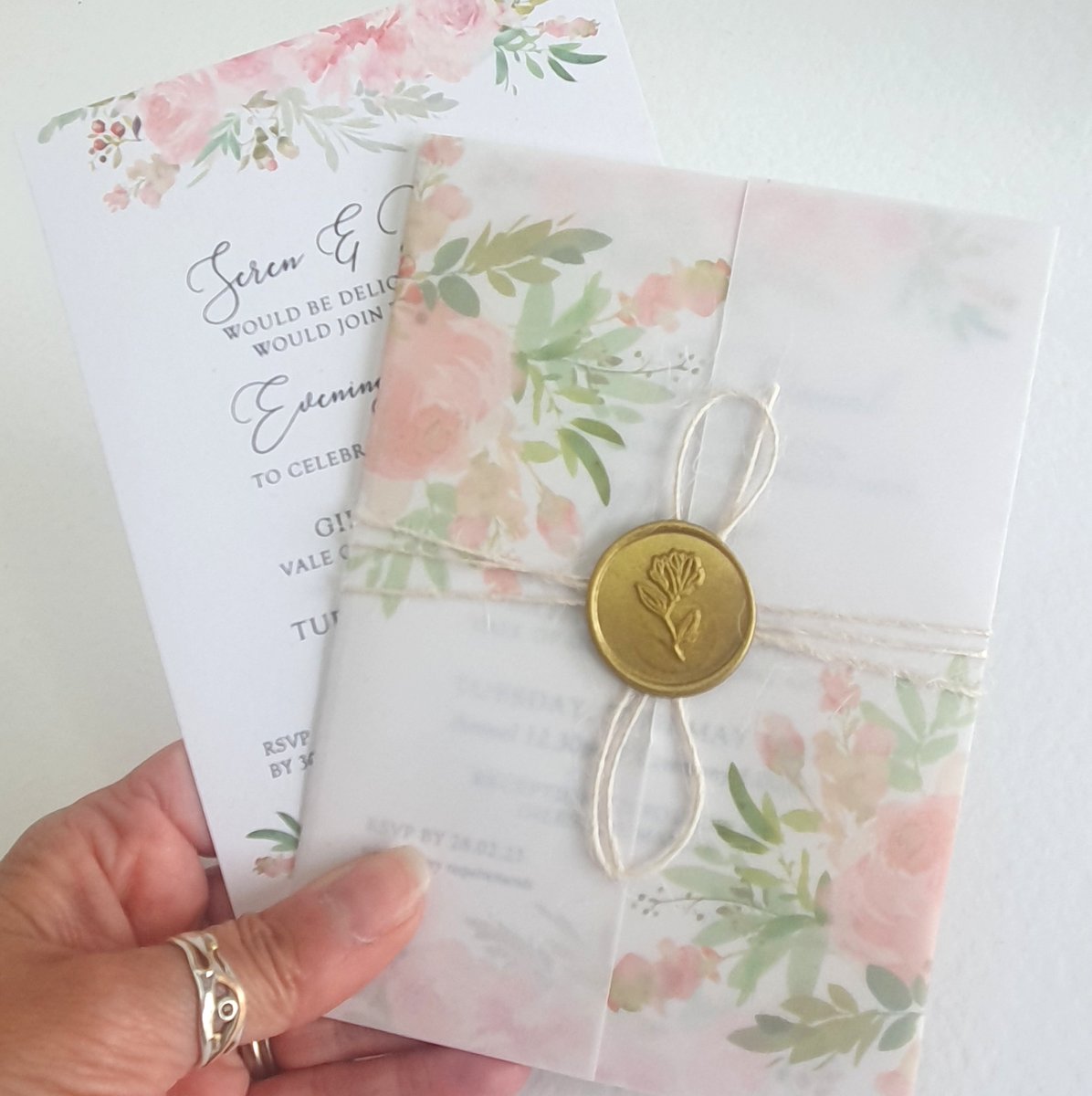 blush pink lforal wedding invitation with vellum wrap and gold wax seal