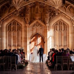 bride groom holding hands bodleian library oxford.jpg 260x260