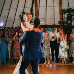 Groom lifting Bride on dancefloor