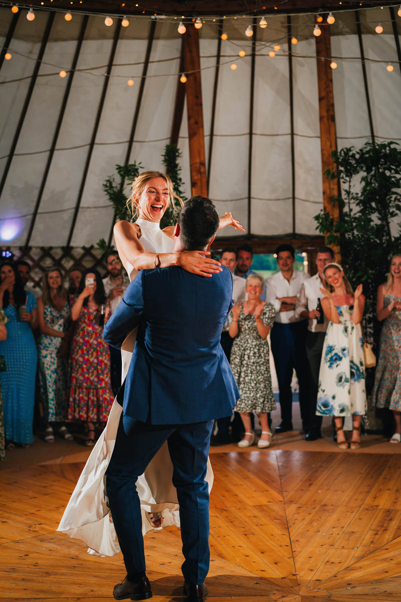 Groom lifting Bride on dancefloor