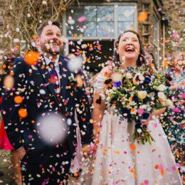 Bride and Grrom in confetti