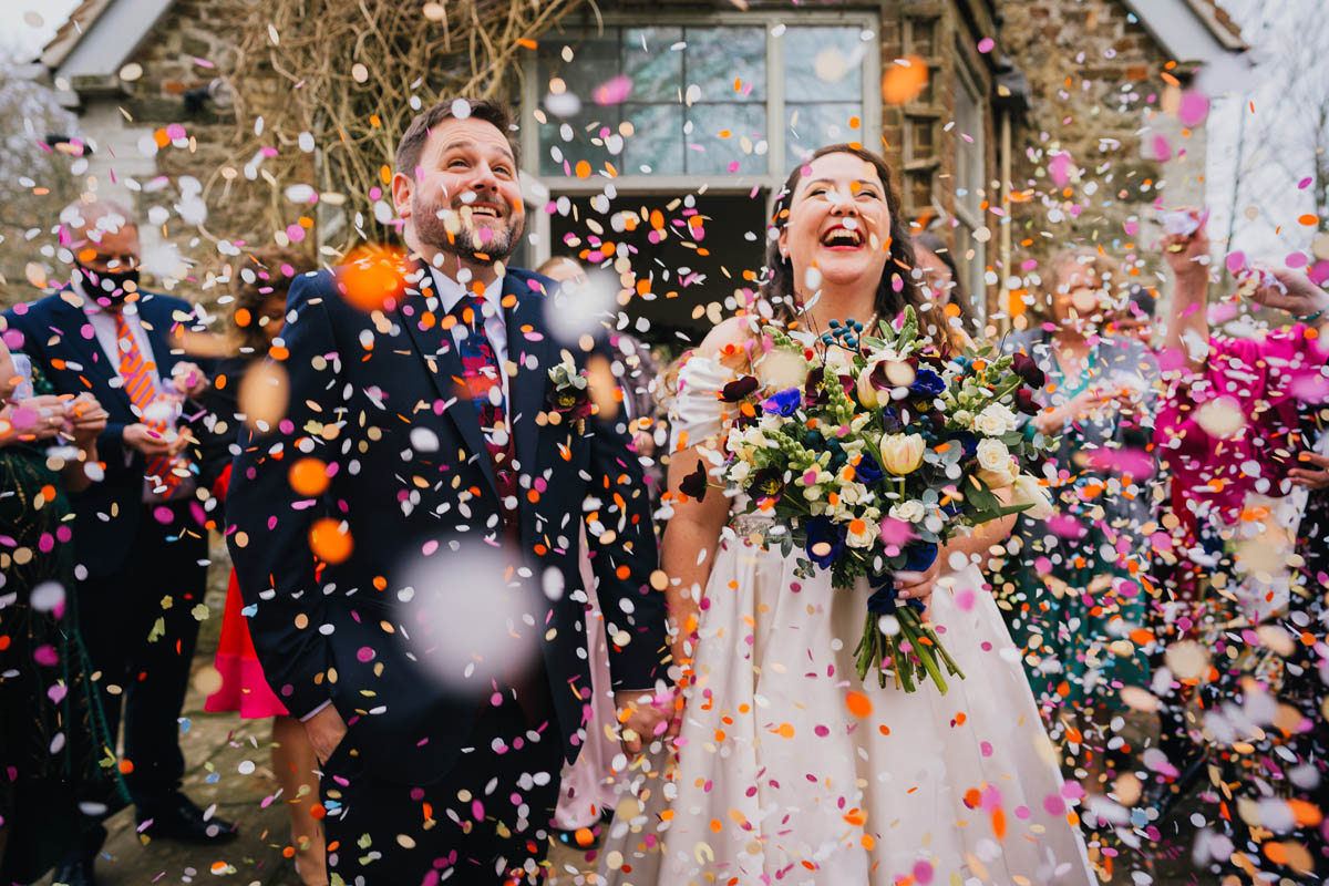 Bride and Grrom in confetti