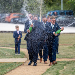 Groomsmen spraying champagne Groomsmen spraying champagne