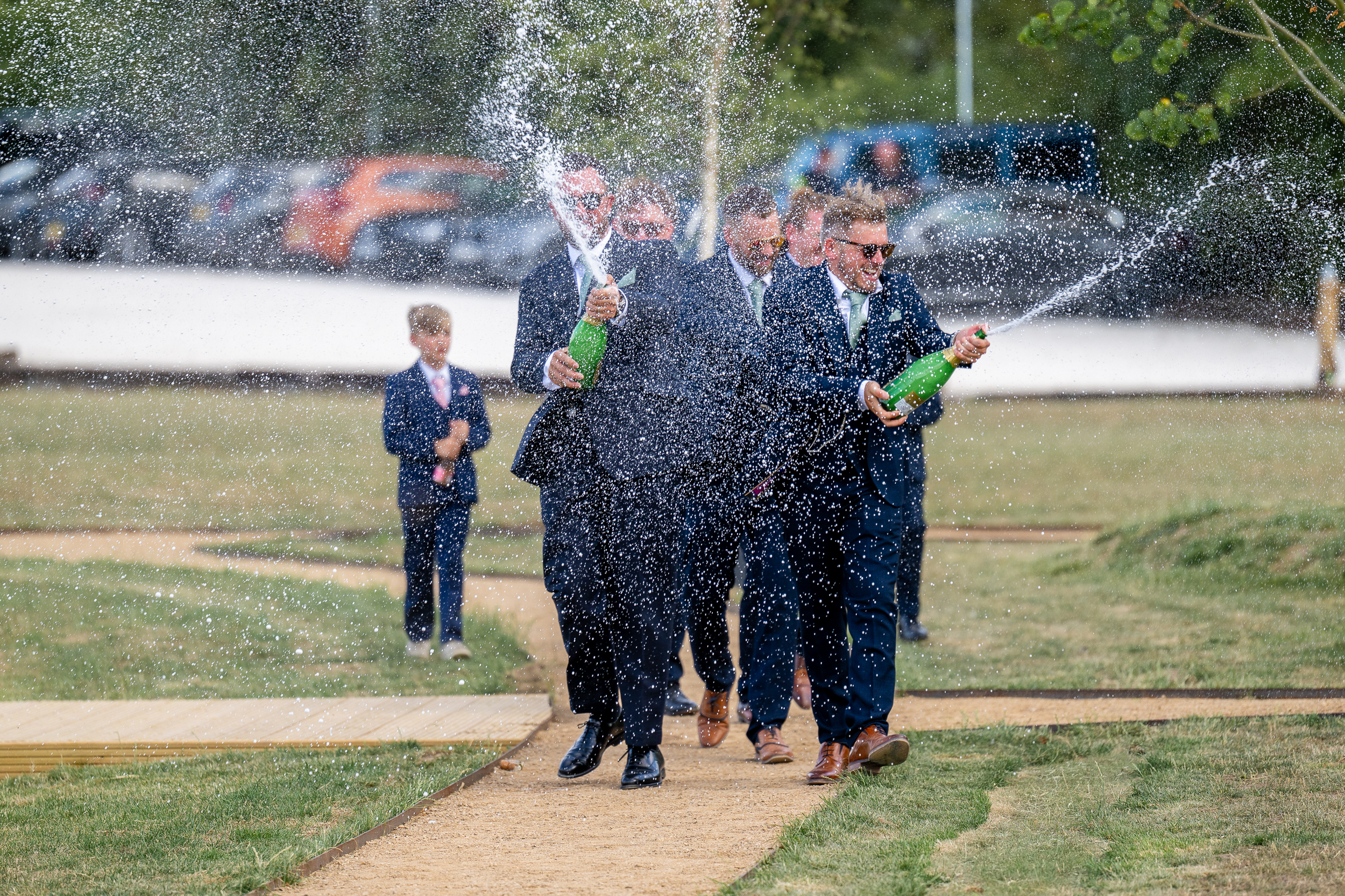 Groomsmen spraying champagne Groomsmen spraying champagne