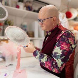 Simon handing a silk bind around the brim of a bespoke wedding hats Simon handing a silk bind around the brim of a bespoke wedding hats
