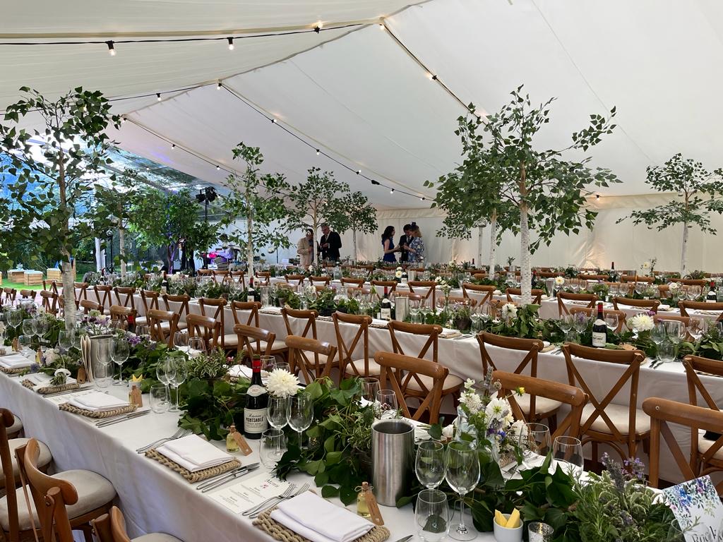 OBG tables 2 with festoon lights and flat ivory lings ad clear roofs over dance floor